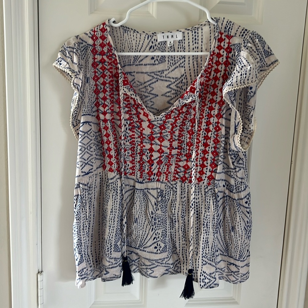 Top with tassel and gorgeous colors. Flows and super fun to wear